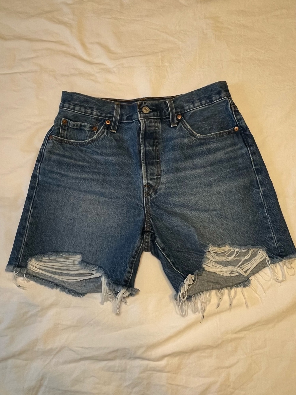Levi’s High-Rise Dark Blue Distressed Denim Shorts